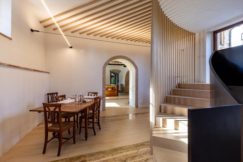 Staircase of Light: pale wood and burnt iron, where geometry meets light